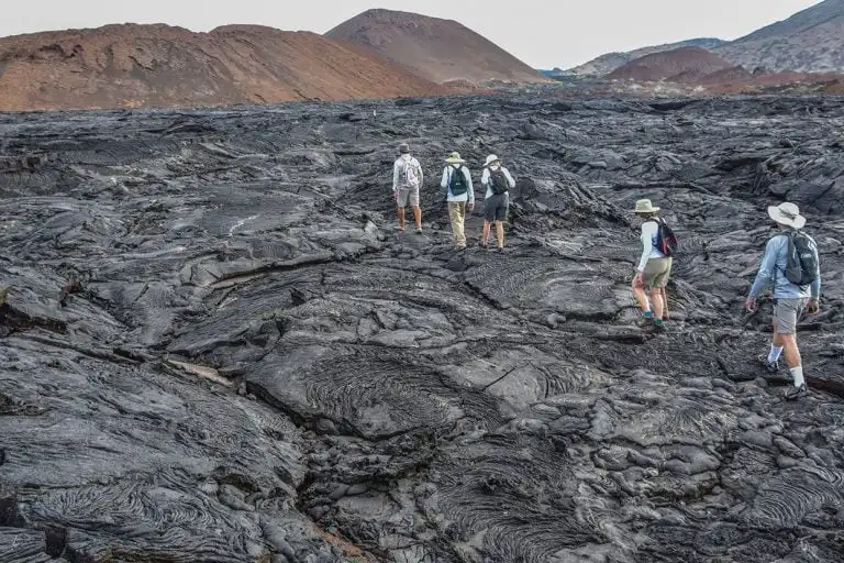 Trekking across lava fields in the Galapagos, an adventure with Yacht La Pinta.