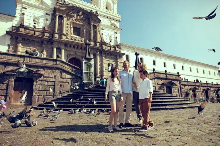 Family enjoying San Francisco Plaza in Quito, a cultural experience with Yacht La Pinta tours