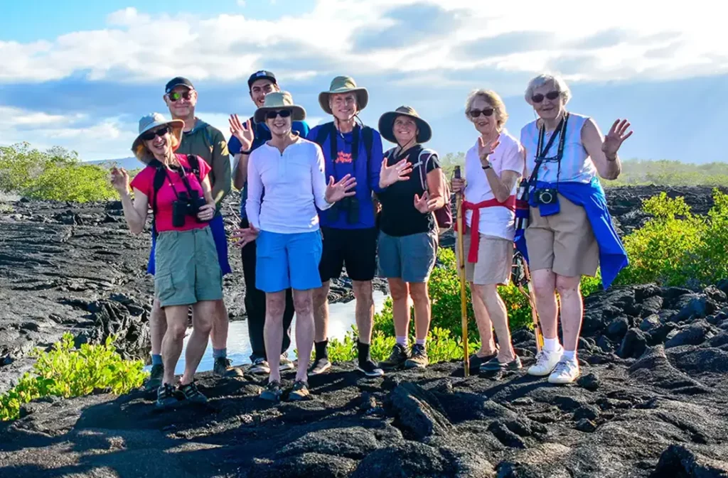 Group of guests on the volcanic lava fields of Fernandina Island